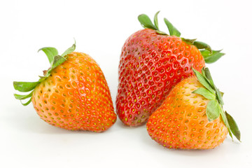 Strawberries with leaves. Isolated on a white background.