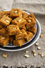 Burfi - indian sweet with milk, chickpea flour, coconut flakes,