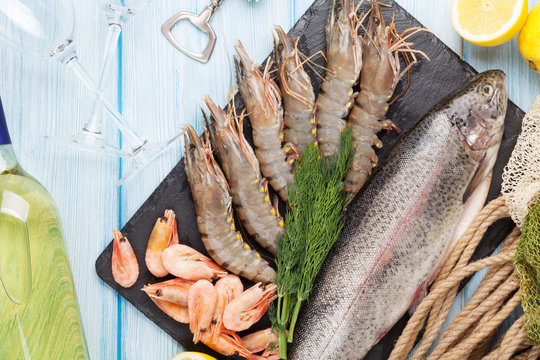 Fresh raw sea food with spices and white wine