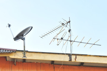 Satellite dish and tv antenna at the roof