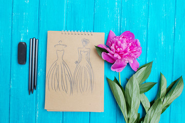Model sketch summer with peony on white wooden background