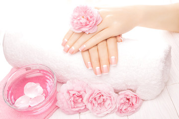 Obraz na płótnie Canvas french manicure with rose flowers. spa