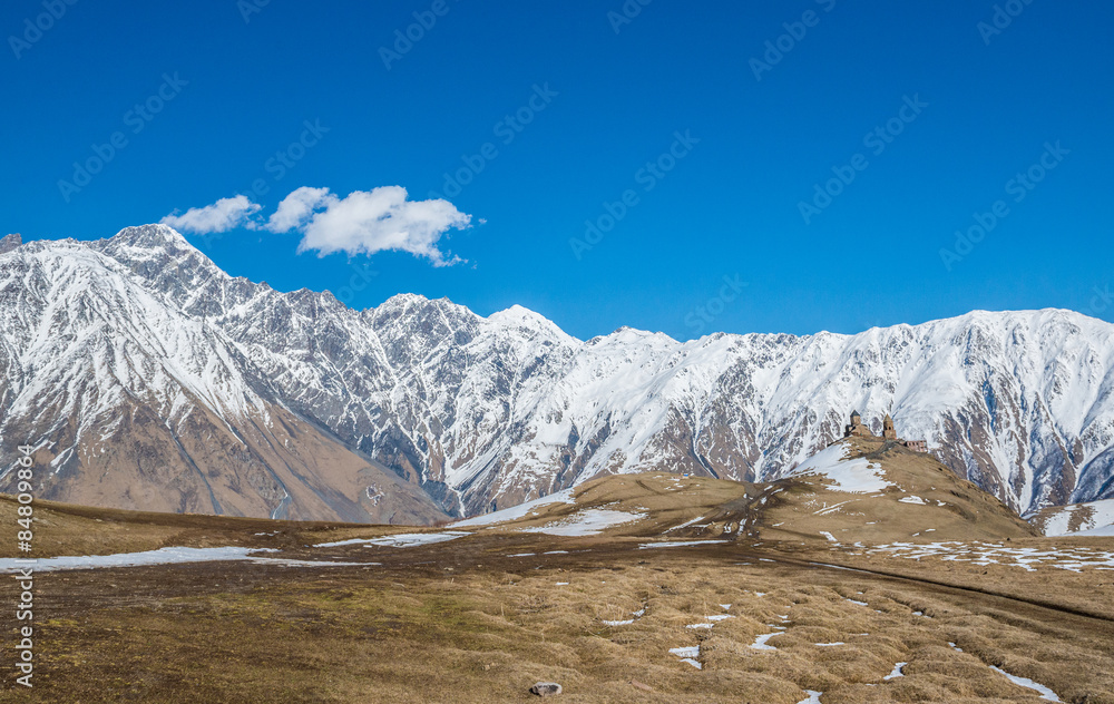 Poster 14th century Holy Trinity Church (Tsminda Sameba) near Mount Kazbek in Georgia