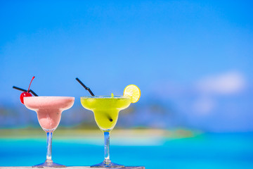 Two tasty cocktails on tropical white beach
