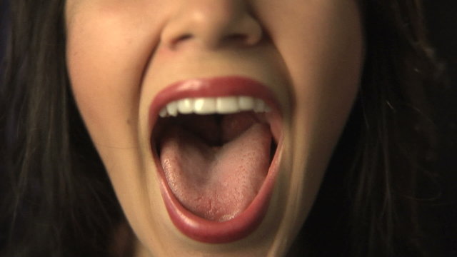 Close up of woman shouting or singing 