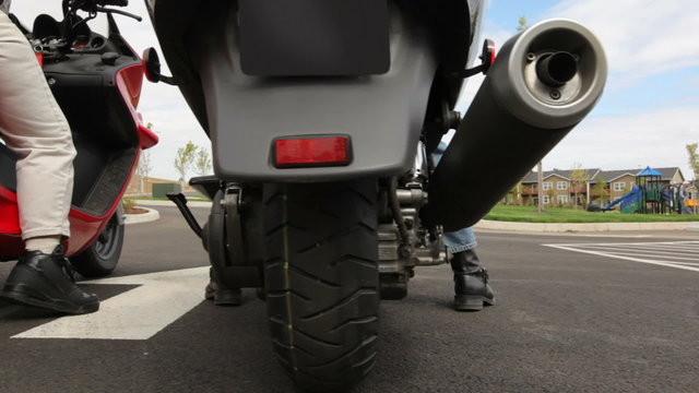 Senior couple on scooters