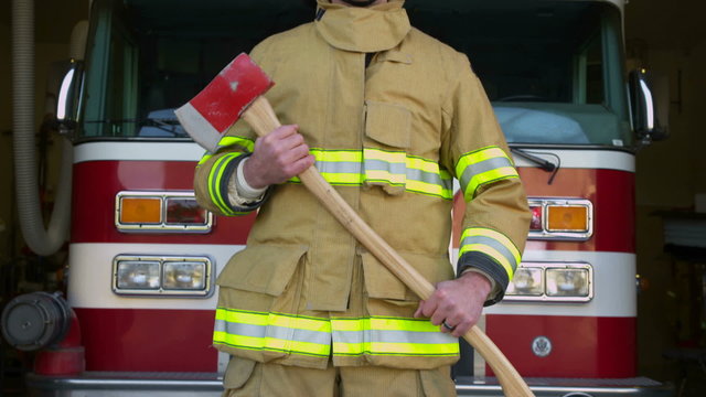 Firefighter portrait in front of firetruck