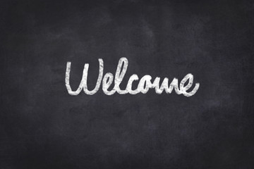 welcome -  text on chalkboard ,  handwritten