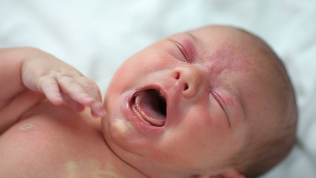 Closeup of crying newborn baby