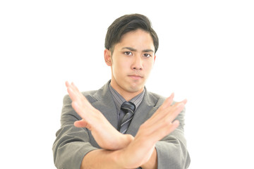 禁止の意思表示をする男性