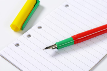 fountain pen on lined paper