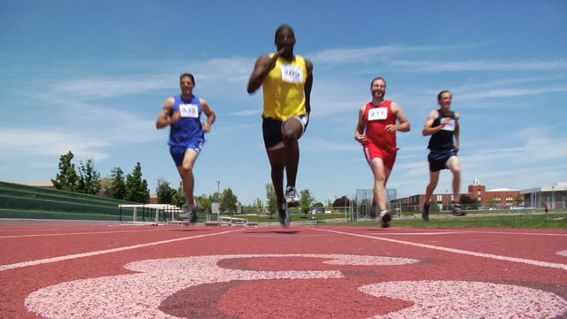 Low angle shot of track runners