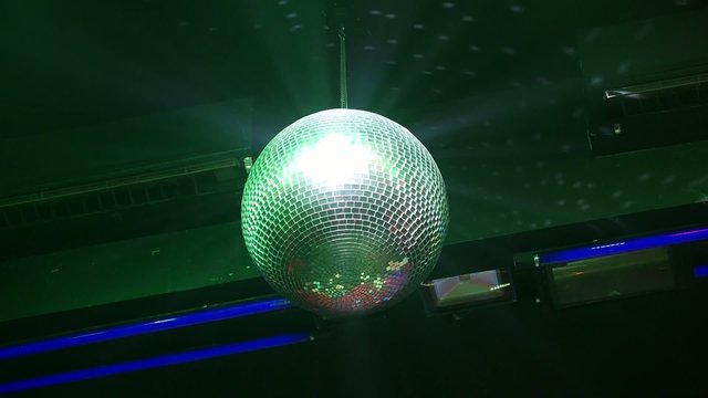 Silver Disco Ball Spinning in Nightclub 