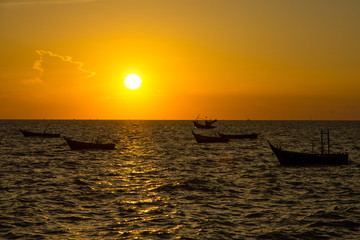 Stock Photo - Scenic View of Boat Floating in The Sea while Suns