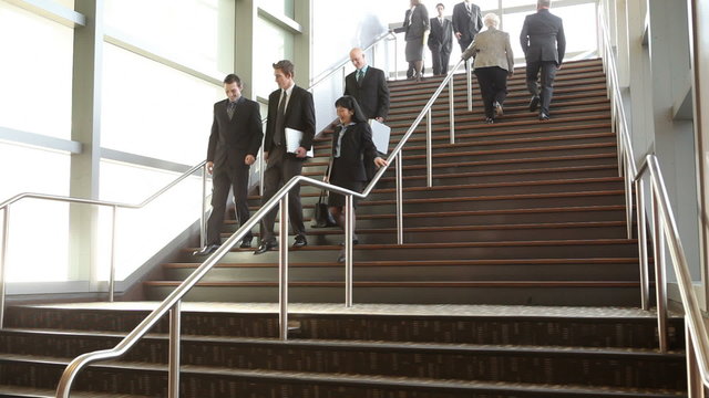Businesspeople walking on stairs
