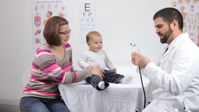 Doctor gives baby a checkup