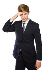 Young businessman confused, feeling stressed, hand in head isola