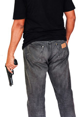 man standing and hand holding gun revolver ,side view on isolate white background