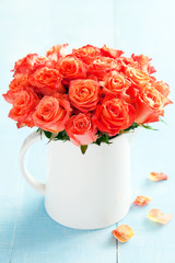 Bouquet of roses in a cup, selective focus