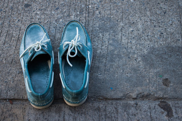 Men shoes on street background