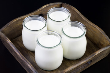 Obraz na płótnie Canvas yogurt in glass jars
