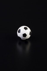 Fototapeta na wymiar soccer ball on a black background