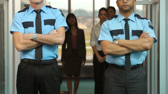 Portrait of two airport security guards