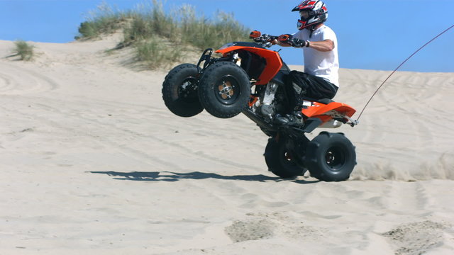 Riding wheelie on a quad, slow motion