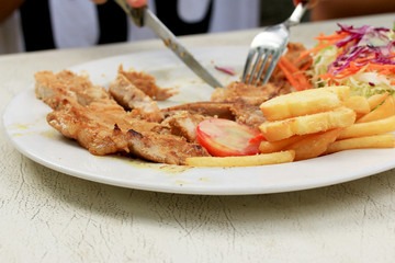 Pork chop, french fries with salad