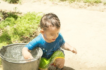 a boy plays with water