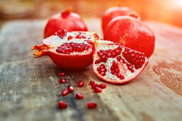 pomegranates on a dark wooden background