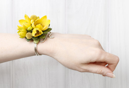 Wrist corsage made of yellow flowers