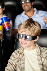 Obraz premium Happy Boy Watching 3D Movie At Theater