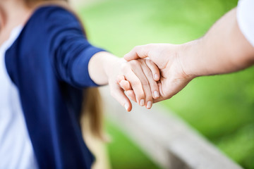 Couple Holding Hands In Park