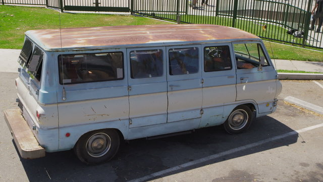 Young people get out of van at skate park