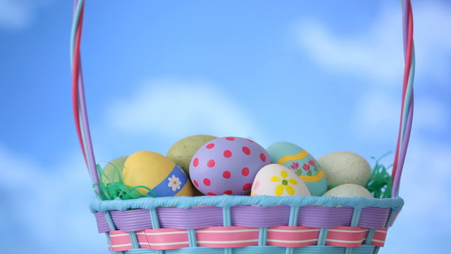 Clouds move by Easter basket