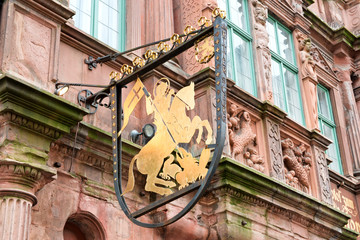 Sign Featuring Golden Rider on Horseback