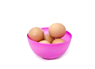 image concept group of eggs in a purple bowl isolated white background