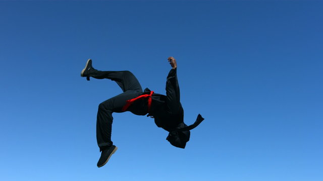 Ninja flips in air, slow motion