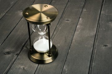 hourglasson wooden background