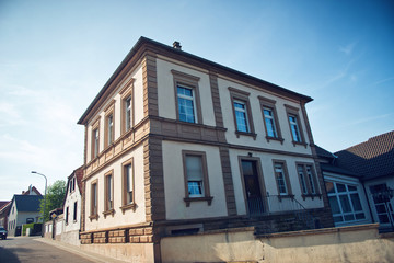 Fototapeta na wymiar Historic Building on Street Corner in Bissersheim
