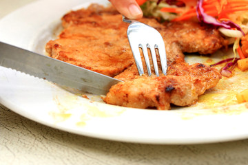 Pork chop, french fries with salad