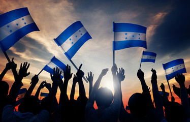 Silhouettes of People Holding Flag of Honduras