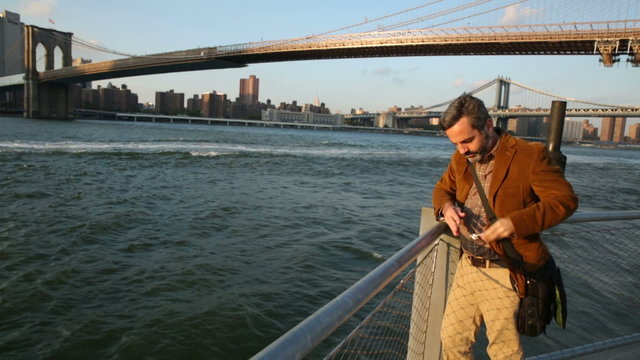 Man enjoying New York waterside view 