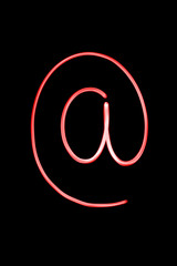 Flourescent letter '@' in neon red color