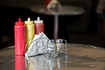 Condiments and napkins on the table in the street cafes. Russia