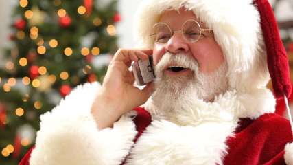 Santa Claus talking on cell phone