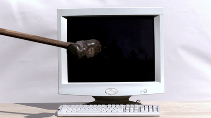 Smashing a computer with  sledge hammer
