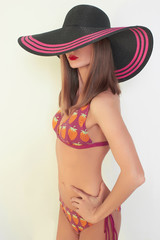 Sexy girl in a bikini and hat
