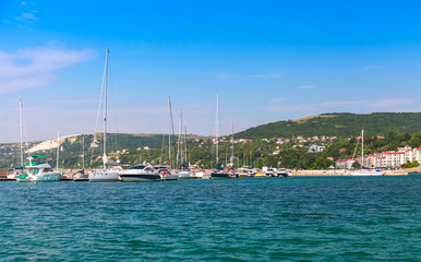 Fototapeta na wymiar Balchik resort town marina. Moored sailing yacht